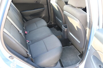 Auto interior with back seats.