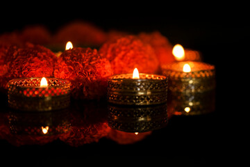 Indian Festival Diwali , oil lamp and flower design on dark background