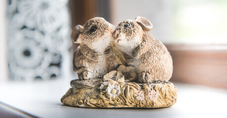 Figures of two mice hugging each other - love symbolism, animals feel emotions