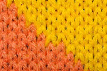 Yellow and red synthetic knitted fabric texture