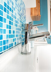 Interior of bathroom with sink basin faucet and mirror. Modern design of bathroom.