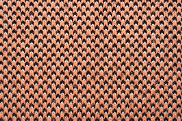 Fototapeta premium Red, white and black synthetic knitted fabric texture