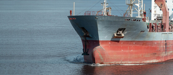 Closeup of multipurpose ship bulbous bow underway.