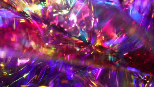 Crystal prism refracting light in vivid rainbow colors. Glass dark blue purple metallic holographic background. Beautiful neon modern magic background for Christmas and new year holiday and party