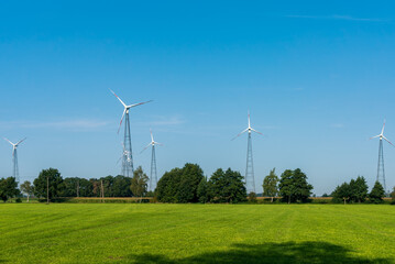 Wind turbines on steel masts in the countryside