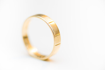 Golden wedding ring isolated on white background