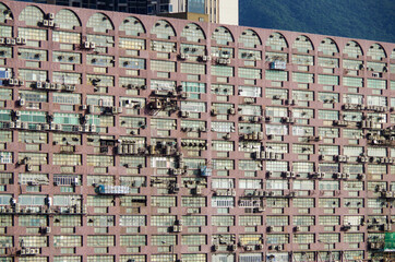 Residential area in old apartment with windows. High-rise building, skyscraper with windows of...