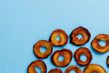 slices of dried plum on a blue background. dried fruits. eco.