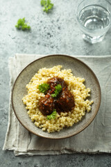 Pasta with homemade meatballs and parsley