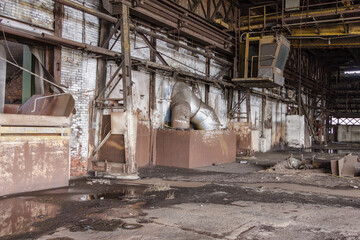 Dirty floor and walls in an abandoned factory in the deep south