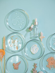 Serum for skin care, eco-friendly cosmetics. Bottles and ingredients for cosmetics