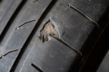 Damaged tyre cord closeup view