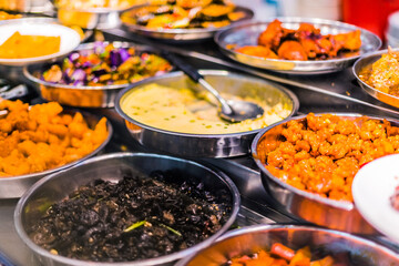 Traditional Asian dishes sold in a food court in Singapore