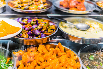 Traditional Asian dishes sold in a food court in Singapore