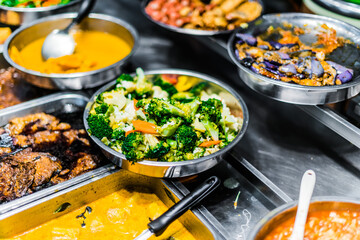 Traditional Asian dishes sold in a food court in Singapore
