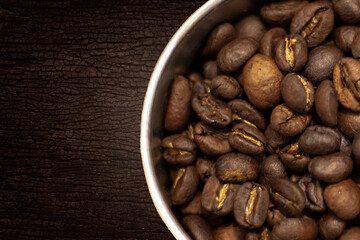 The coffee seed put on wood background, top view