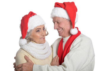 Portrait of happy senior couple in Santa hats