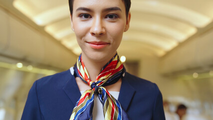 Cabin crew or air hostess working in airplane . Airline transportation and tourism concept.