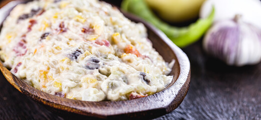 mayonnaise with vegetables, Brazilian tradition. Mayonnaise with corn, potatoes, lentils, tomatoes, eggs and raisins. Brazilian garrison for parties and events