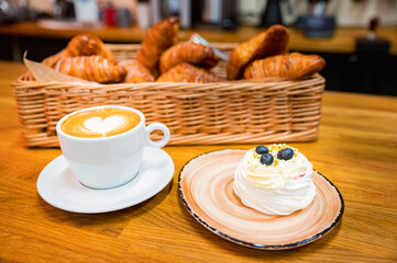 Meringue cake decorated with blueberry and coffee