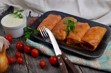 Cabbage rolls stuffed with ground meat and rice. Delicious homemade stuffed cabbage leaves with meat, rice and spices