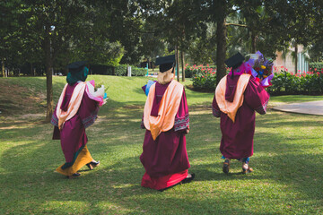 Graduation Concept. Graduates walking to the ceremony.