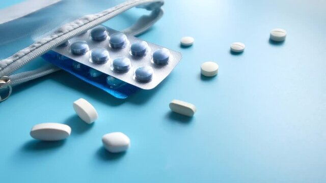 Close up of pills and blister pack on color background 