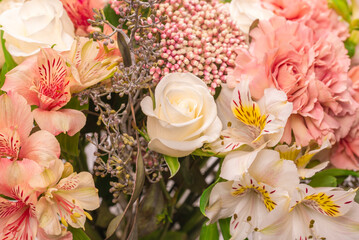 Bouquet of  soft pink flowers in wrapping paper.
