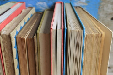 Close-up of old books arranged in the library Old wooden floor as background selective focus and shallow depth of field