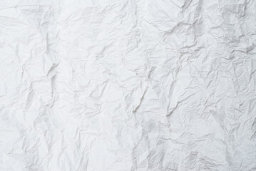Crumpled white paper background.