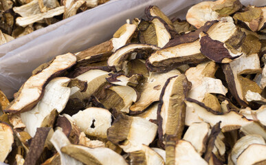 A counter with thinly sliced dried forest mushrooms