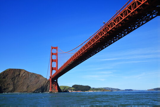 Famous Golden Gate Bridge in San Francisco. The Golden Gate Bridge is a suspension bridge spanning the Golden Gate connecting San Francisco bay and pacific ocean - Powered by Adobe