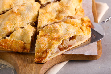 Spicy pear and raisin pie, sliced