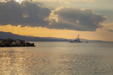 Boat on the ocean in a golden hour.