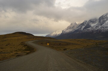 Hiking around the dramatic and windy mountain landscapes of Torres del Paine in Patagonia, Chile