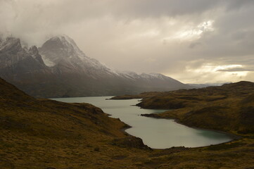 Hiking around the dramatic and windy mountain landscapes of Torres del Paine in Patagonia, Chile