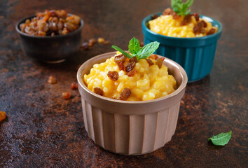 Pumpkin porridge with rice and raisins. Tasty healthy diet breakfast. Proper nutrition