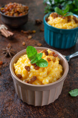 Pumpkin porridge with rice and raisins. Tasty healthy diet breakfast. Proper nutrition