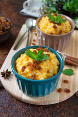 Pumpkin porridge with rice and raisins. Tasty healthy diet breakfast. Proper nutrition