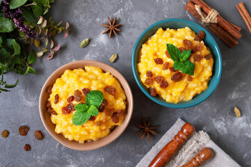 Pumpkin porridge with rice and raisins. Tasty healthy diet breakfast. Proper nutrition