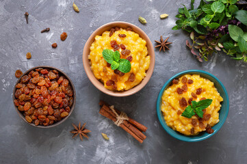 Pumpkin porridge with rice and raisins. Tasty healthy diet breakfast. Proper nutrition