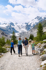 Morteratsch, Switzerland - July 22, 2020 : Tourists at Morteratsch Glacier trail