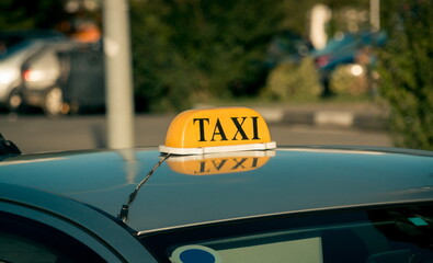 Sign of the taxi on the car