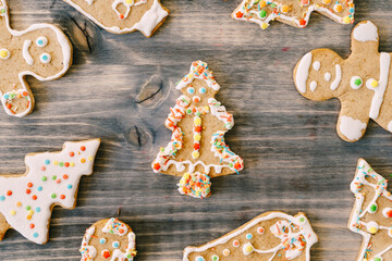Christmas and New Year celebration traditions. Texture with homemade gingerbread cookies on wooden table. Family home bakery, cooking festive sweets