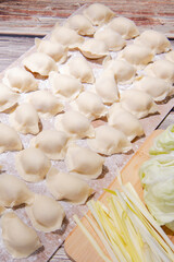 The dough is flour and the filling is meat and vegetables.