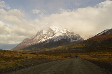 Hiking around the dramatic and windy mountain landscapes of Torres del Paine in Patagonia, Chile