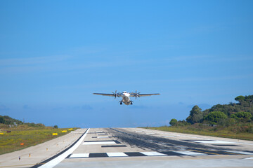 plane takes off, from small airport