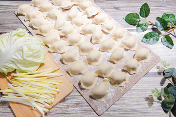 The dough is flour and the filling is meat and vegetables.