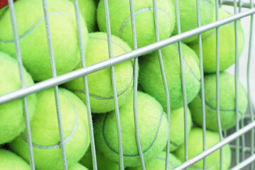 Many Tennis Balls in The Metal Basket