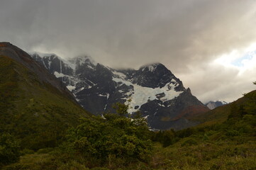 Fototapeta premium Hiking around the dramatic and windswept mountain landscapes of the Torres del Paine National Park in Patagonia, Chile